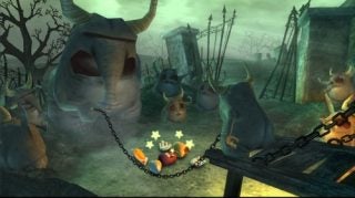 A screenshot from the game Rayman Raving Rabbids showing a scene where caged creatures watch over a character, likely Rayman, who is lying on the ground with stars spinning around his head, indicating a state of dizziness or confusion. The setting appears to be a gloomy environment with a rhinoceros sculpture, eerie lighting, and wooden structures in the background.