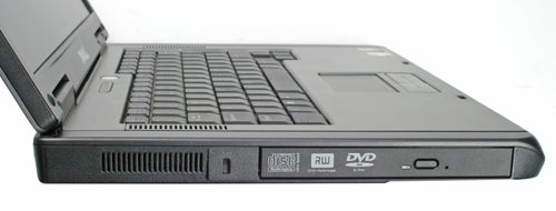 Side view of a Dell Latitude 131L laptop with the lid partially open, showing the keyboard, side ports, and a DVD-RW drive.