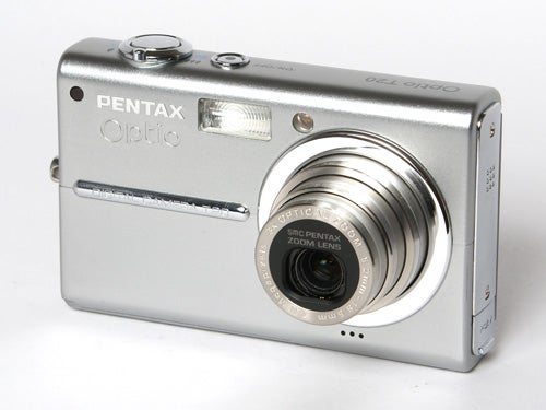 A silver Pentax Optio T20 digital camera placed on a white background, showing the lens extended and the front of the camera with branding visible.