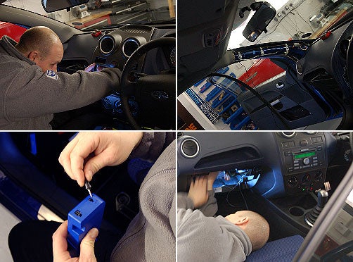 A collage of four images showing the installation process of the Parrot MK600 Bluetooth car kit in a vehicle. The top left photo depicts a person reaching to the dashboard of a car, the top right shows cables and electronics behind the car's dashboard, the bottom left features hands holding the blue Parrot MK600 Bluetooth box, and the bottom right image demonstrates the wiring process under the car's dashboard.