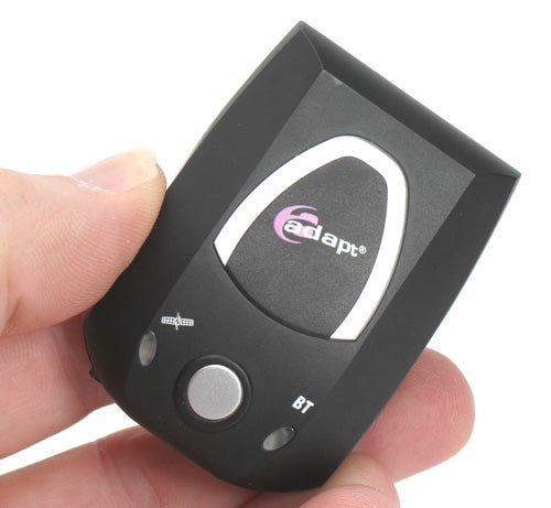Hand holding the Adapt AD-750 Bluetooth Receiver, showcasing the front panel with logo, display screen, and control buttons.