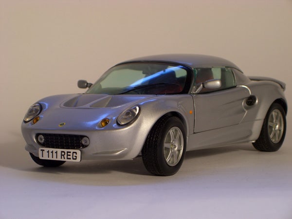 Silver Lotus sports car model displayed on a white background