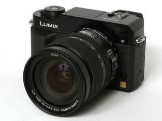 Panasonic DMC-L1 Digital SLR camera with a Leica lens displayed on a white background.