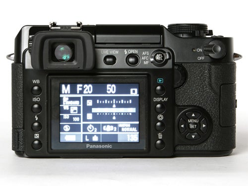 Rear view of a Panasonic DMC-L1 Digital SLR camera showing the LCD screen display and various control buttons.