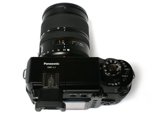 Panasonic DMC-L1 Digital SLR camera with a Leica lens viewed from the top on a white background.