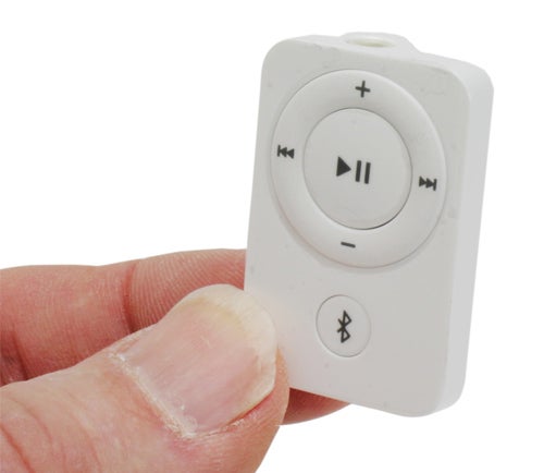 White Gear4 BluEye device held between fingers showcasing the front with control buttons and Bluetooth symbol.