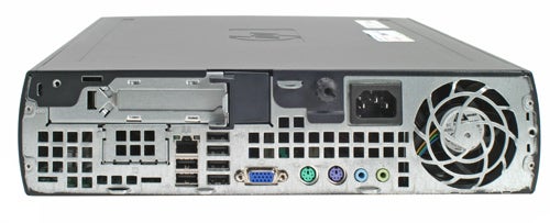HP Compaq dc7700p Ultra-slim Desktop computer rear view showing various ports including USB, Ethernet, serial, and parallel connections along with power input and expansion slot.