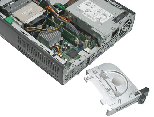 HP Compaq dc7700p Ultra-slim Desktop opened case showing internal components and architecture with detached silver optical drive bay on the right.