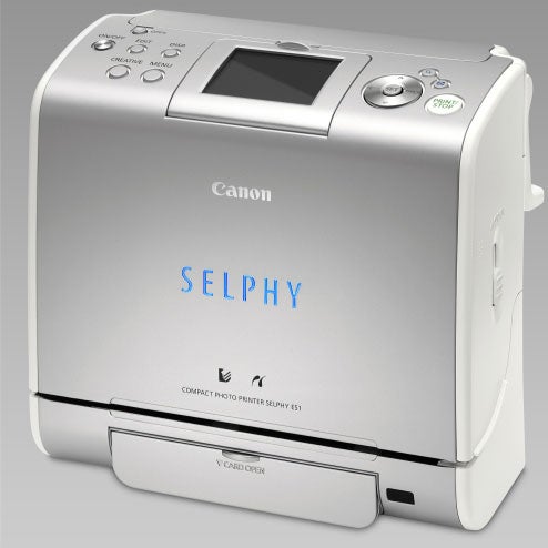 Canon Selphy ES1 Compact Photo Printer with LCD screen and buttons displayed on top.