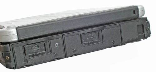 Side view of a closed Panasonic ToughBook CF-19 showing its rugged design with port covers and reinforced corners.