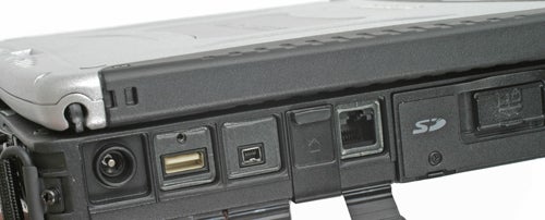 Close-up of the side panel of a Panasonic ToughBook CF-19 showing various ports including USB, Ethernet, and SD card slot with the rugged laptop's durable casing.