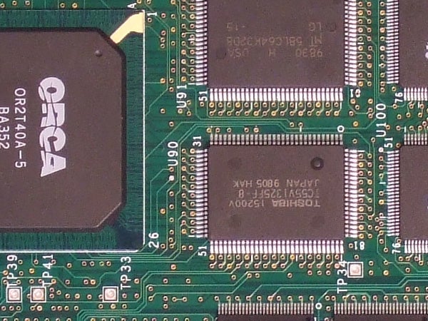 Close-up of a camera's electronic circuit board, potentially representing the internals of the Fujifilm FinePix F31fd camera, showcasing the image sensor and processing chip.