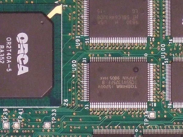 Close-up image of an electronic circuit board potentially from a digital camera like the Fujifilm FinePix F31fd, showcasing integrated circuits and other electronic components.
