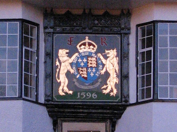 Coat of arms on a building facade taken with a Canon PowerShot S3 IS showing color and detail capture by the camera.