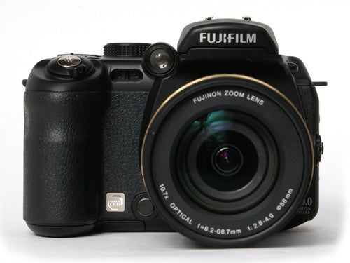 Fujifilm FinePix S9600 digital camera with a Fujinon zoom lens displayed against a white background.
