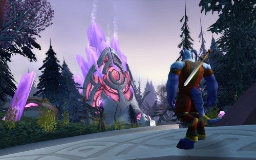 Screenshot from the game World of Warcraft: The Burning Crusade showing a character in armor holding a bow and arrow, with a large, crystal-like structure in the background amidst a magical-looking forest environment.