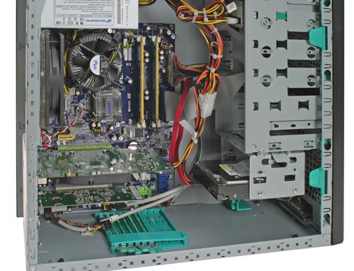 Interior view of an open desktop computer case showing components including the motherboard, RAM, expansion cards, and power supply, related to an Evesham Solar Storm 731 product review.