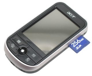 Acer c510 Pocket PC Travel Companion displayed with a 256 MB SD memory card inserted on the right side, featuring a black and silver color scheme and a touchscreen interface with control buttons below the screen.
