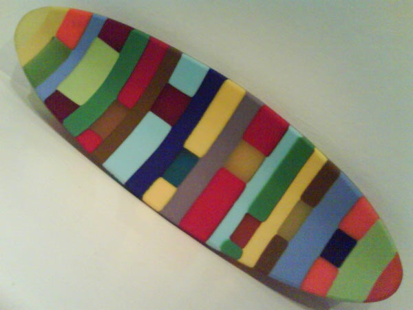 Multicolored patterned surface of an object resembling a phone cover, potentially related to Sony Ericsson W710i.