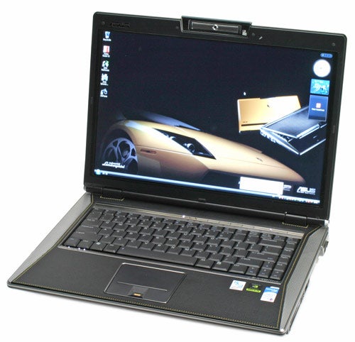 An ASUS laptop open and displaying a car-themed wallpaper on its screen.