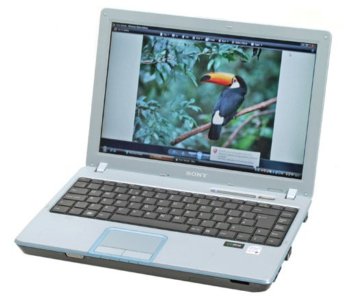 Sony VAIO VGN-C2SL laptop with a white case open at an angle displaying a colorful bird on the screen.