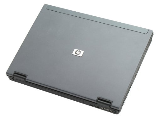 HP Compaq nc6400 laptop with a closed lid, showing the HP logo on the top cover, viewed from a slight angle against a white background.