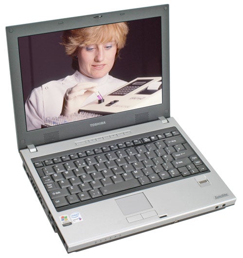 Toshiba Satellite U200-161 laptop displayed open on a white background with a screen showing an image of a woman examining a chromatography or test strip.