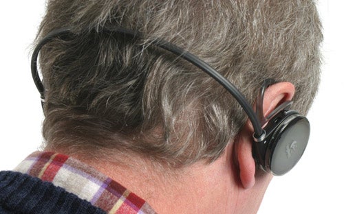 Person wearing Logitech FreePulse Wireless Headphones with a clear view of the headphone design fitted over the ears.