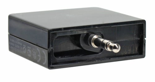 Black Logitech FreePulse Wireless Headphones transmitter with a 3.5 mm audio jack plug.