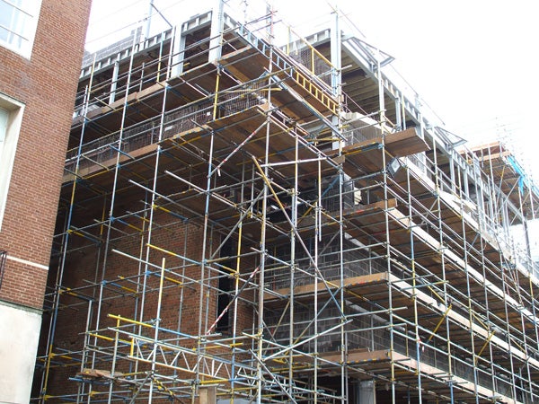 Photograph of intricate scaffolding outside a brick building showcasing the image clarity and detail captured by the Fujifilm FinePix A700 digital camera.