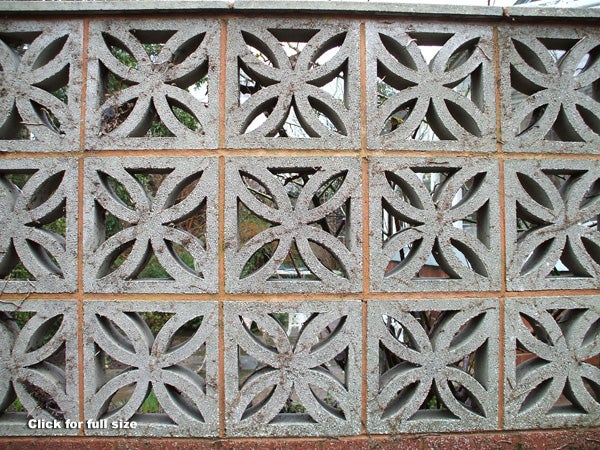 Decorative concrete block wall with a star pattern, demonstrating the image quality and detail capture of the Fujifilm FinePix A700 camera.