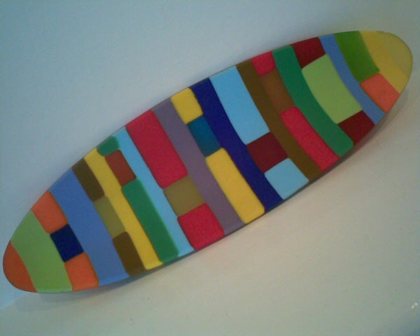 Colorful abstract painted surfboard artwork displayed on a white background.