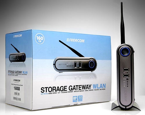 Freecom FSG-3 Storage Gateway WLAN product and its packaging box on display, featuring a 160GB hard drive and wireless network capabilities.