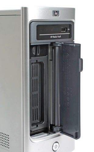 HP MediaVault mv2020 network storage server with an open front bay door showing slots for hard drives.