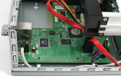 Interior view of an HP MediaVault mv2020 showing the circuit board, wiring, and internal components.