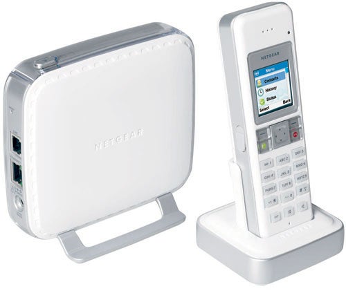 NETGEAR SPH200D Skype Phone with dual-mode cordless handset on charging cradle and base station with Ethernet ports.