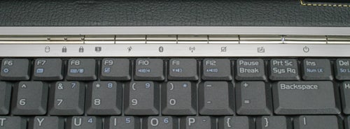 Close-up of the keyboard of an Asus Lamborghini VX2 laptop with focus on the function keys and a textured black palm rest area.
