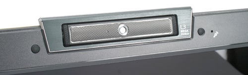 Close-up of the Asus Lamborghini VX2 laptop's hinge design featuring the speaker grille, power button, and VGA webcam.