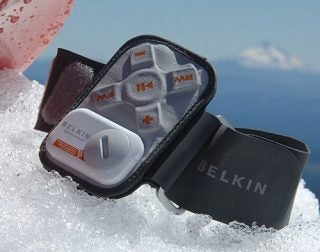 Belkin SportCommand remote control for iPod on a snowy background.