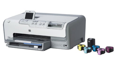 HP Photosmart D7160 printer on a white background with its ink cartridges displayed in front.