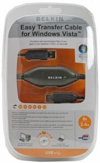Belkin Easy Transfer Cable for Windows Vista packaging showing the product secured in a clear plastic casing with an orange and black design. The packaging highlights the cable's 8 ft length and USB compatibility features, with descriptive text indicating its use for transferring and synchronizing files of any type or size between two PCs.