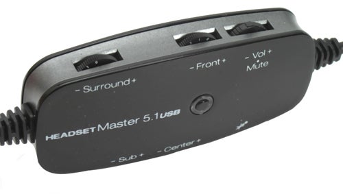 Close-up of Terratec Headset Master 5.1 USB control unit with volume and sound settings buttons.