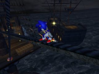 Sonic the Hedgehog character running across a rope between pirate ships at night in the video game Sonic and the Secret Rings.