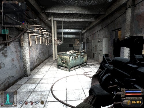 A first-person view screenshot from the game S.T.A.L.K.E.R: Shadow of Chernobyl showing a player character holding a firearm inside an industrial environment with concrete walls and metallic structures.