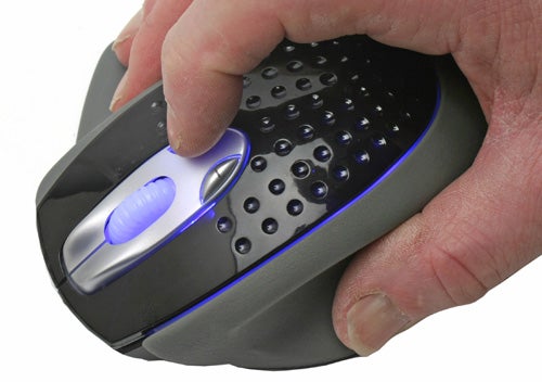 Close-up of a hand gripping the Fanatec Headshot controller, showcasing the mouse's ergonomic design, distinctive button arrangement, and blue LED accents.