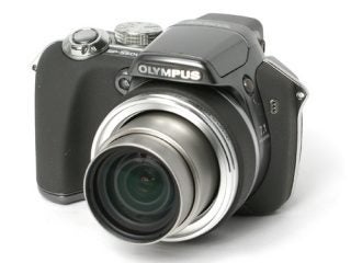 Olympus SP-550UZ digital camera with extended zoom lens on a white background.