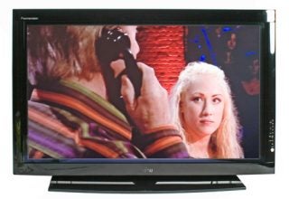 Fujitsu Plasmavision P42XHA58 42-inch Plasma TV displaying a scene with two actors, one holding a camera, with vivid color reproduction and a sleek black frame design.