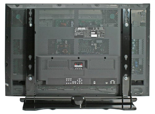 Rear view of Fujitsu Plasmavision P42XHA58 42-inch Plasma TV showing ports, model label, and stand.
