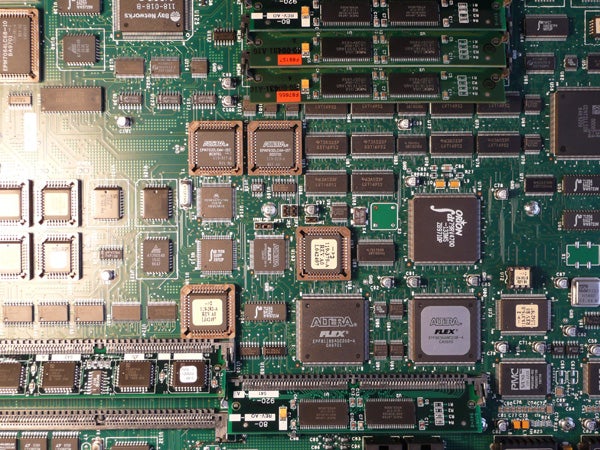 Close-up of an electronic circuit board with various integrated circuits and components.
