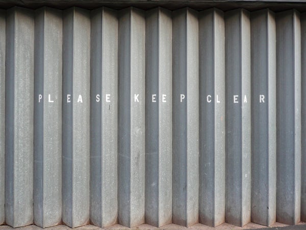 Corrugated metal surface with the words 
